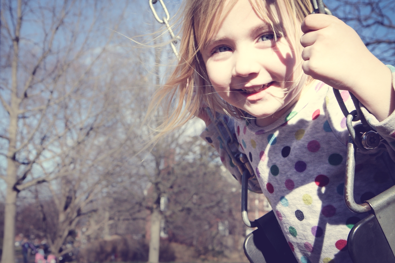 Girl swings on a sunny day in winter NotSoSAHM