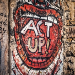 A piece of the Berlin Wall on exhibit at the Newseum in Washington D.C. has an open mouth with the words ACT UP painted in the mouth NotSoSAHM